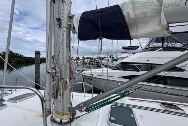 Must Love Dogs Yacht Photos Pics Beneteau 50 sailboat deck view, 1996 model, docked at marina with other boats.