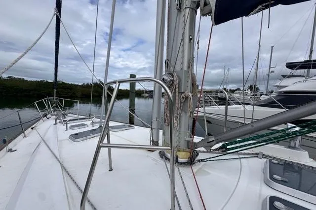 Must Love Dogs Yacht Photos Pics Sailboat deck view of a 1996 Beneteau 50 in a marina setting.