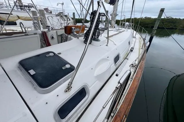 Must Love Dogs Yacht Photos Pics 1996 Beneteau 50 sailboat docked, showcasing deck and rigging details.