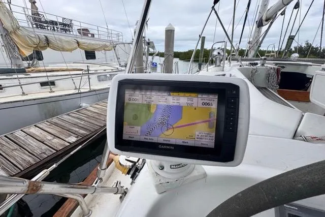Must Love Dogs Yacht Photos Pics Garmin navigation system on a 1996 Beneteau 50 sailboat at a marina.