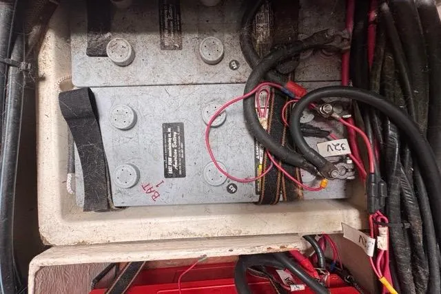 Must Love Dogs Yacht Photos Pics Battery compartment of a 1996 Beneteau 50 sailboat with wiring and connections.