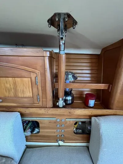 L'attitude Yacht Photos Pics Interior of a 1996 Sabre 402 sailboat with wooden cabinetry and seating.