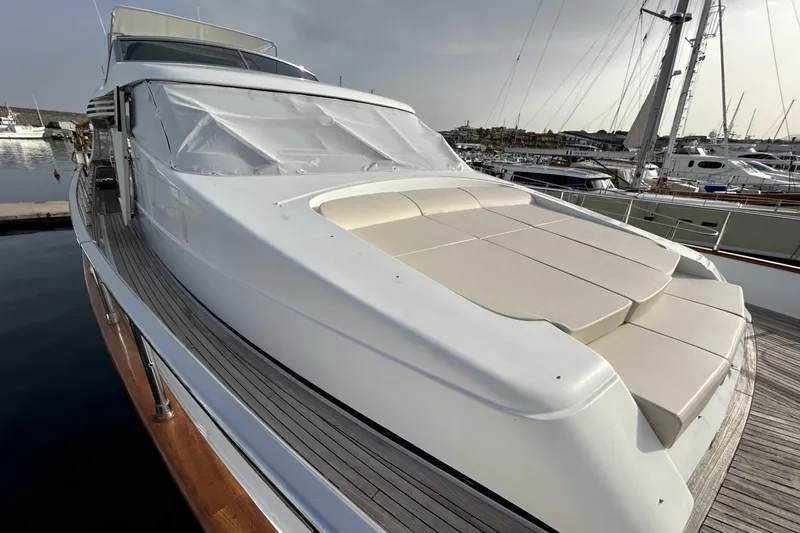  Yacht Photos Pics Sanlorenzo SL72 2002 yacht with sleek design and spacious deck in marina setting.