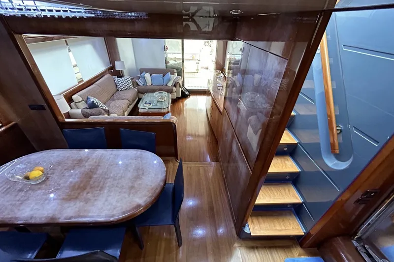  Yacht Photos Pics Luxurious interior of 2002 Sanlorenzo SL72 yacht with elegant dining and seating areas.