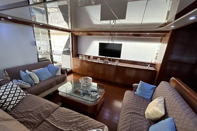  Yacht Photos Pics Luxurious interior of 2002 Sanlorenzo SL72 yacht with plush seating and modern decor.