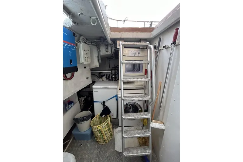  Yacht Photos Pics Engine room of 2002 Sanlorenzo SL72 yacht with ladder and equipment.