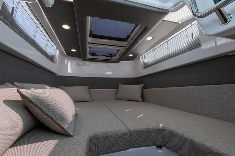  Yacht Photos Pics Luxurious interior of 2024 Axopar 37 Sun Top boat with comfortable seating and skylight.