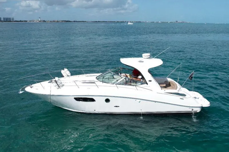 2012 Sea Ray 370 Da @ Cancun Sogu Yacht Photos Pics 2012 Sea Ray 370 Sundancer yacht cruising on open water under a cloudy sky.