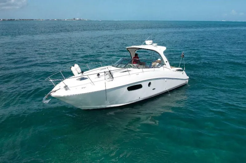 2012 Sea Ray 370 Da @ Cancun Sogu Yacht Photos Pics 2012 Sea Ray 370 Sundancer yacht cruising on clear blue ocean waters.