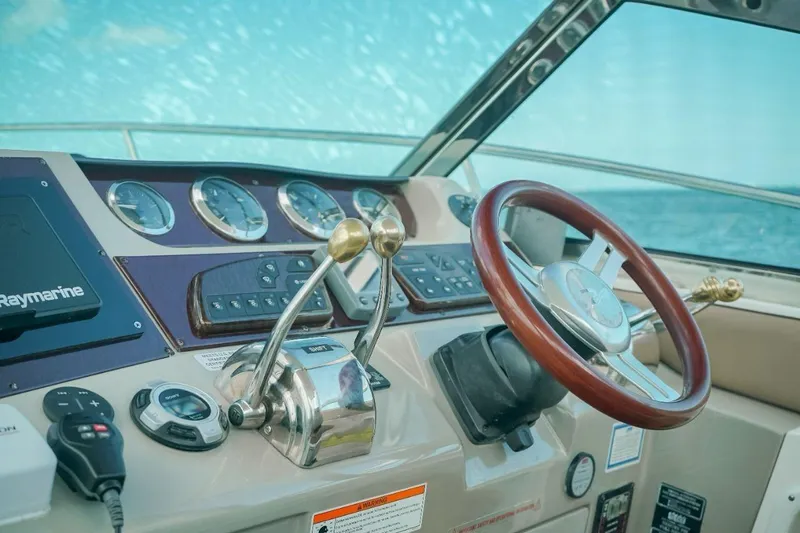 2012 Sea Ray 370 Da @ Cancun Sogu Yacht Photos Pics Cockpit of 2012 Sea Ray 370 Sundancer with steering wheel and control panel.