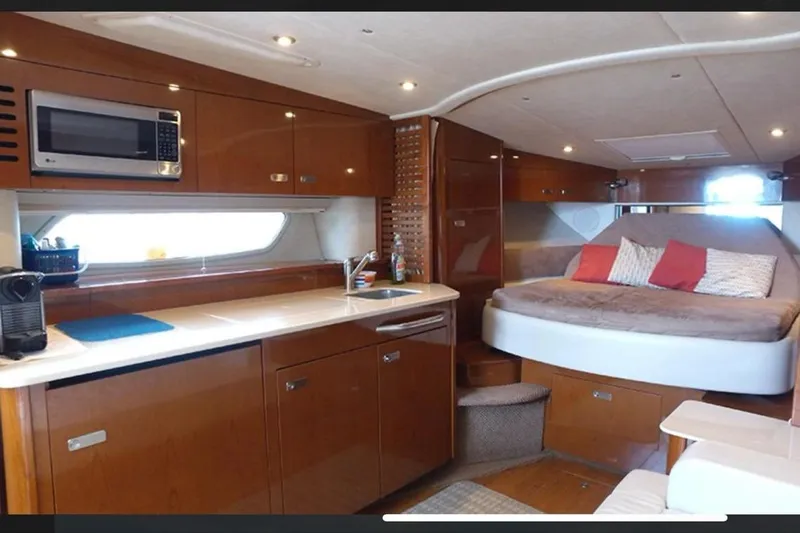 2012 Sea Ray 370 Da @ Cancun Sogu Yacht Photos Pics Luxurious interior of 2012 Sea Ray 370 Sundancer yacht with kitchen and cozy bed.