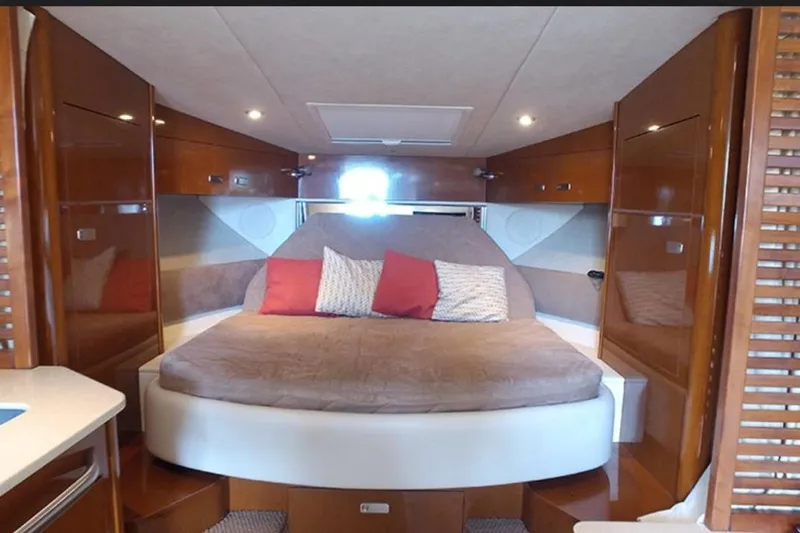 2012 Sea Ray 370 Da @ Cancun Sogu Yacht Photos Pics Luxurious cabin interior of 2012 Sea Ray 370 Sundancer with cozy bed and elegant wood finish.