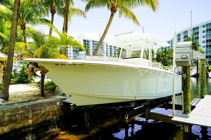  Yacht Photos Pics 2016 Sea Hunt Gamefish 30 boat docked near palm trees and waterfront buildings.