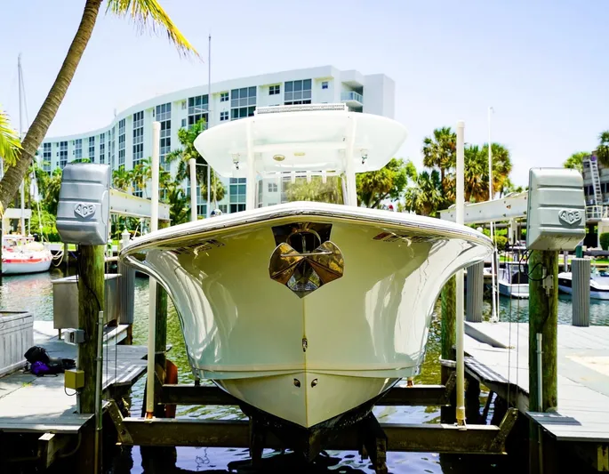  Yacht Photos Pics 2016 Sea Hunt Gamefish 30 boat docked at marina with modern building backdrop.