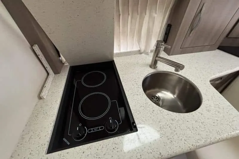  Yacht Photos Pics 2019 Regal 33 XO yacht kitchen with stovetop and round sink.