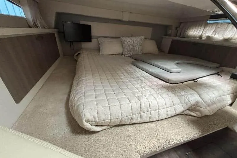  Yacht Photos Pics Interior cabin of 2019 Regal 33 XO yacht with cozy bed and TV.