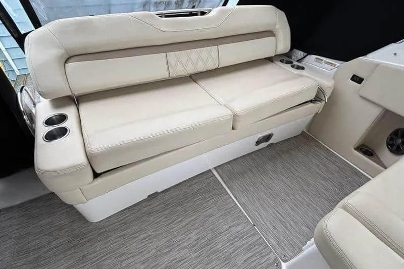  Yacht Photos Pics 2019 Regal 33 XO boat interior with beige seating and cup holders.