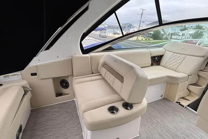  Yacht Photos Pics Luxurious interior of 2019 Regal 33 XO boat with beige seating and modern design.
