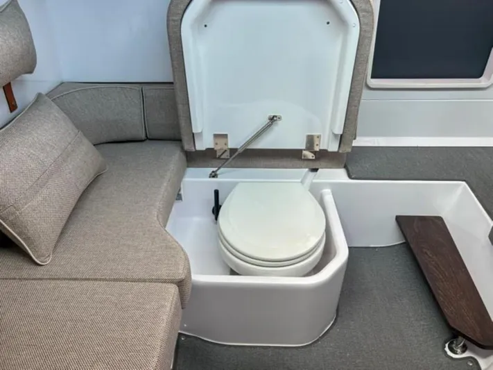  Yacht Photos Pics 2024 Axopar 37XC CROSS CABIN interior with hidden toilet under seat.