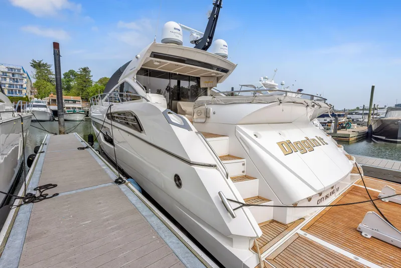 Diggin It Yacht Photos Pics 2015 Sunseeker Predator 68 yacht docked at marina.
