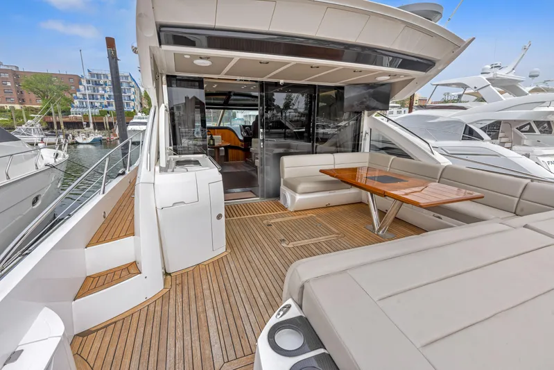 Diggin It Yacht Photos Pics 2015 Sunseeker Predator 68 yacht with spacious deck and seating area.