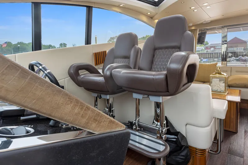 Diggin It Yacht Photos Pics Interior helm seating of 2015 Sunseeker Predator 68 yacht with luxurious leather chairs.