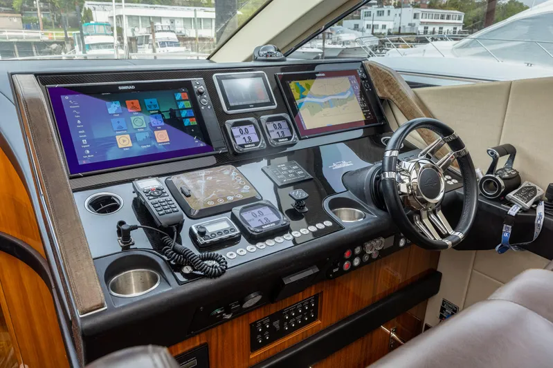 Diggin It Yacht Photos Pics Sunseeker Predator 68 2015 yacht helm with advanced navigation systems and luxurious design.
