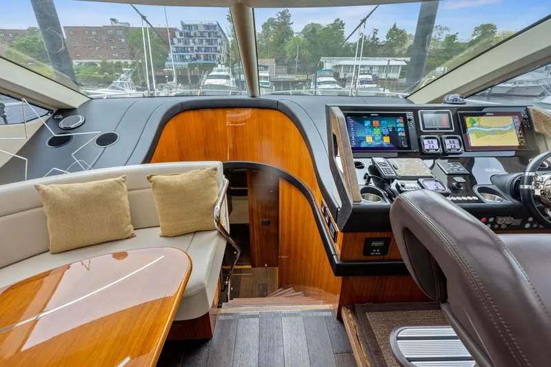 Diggin It Yacht Photos Pics Interior of 2015 Sunseeker Predator 68 yacht with modern helm and seating area.