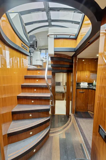 Diggin It Yacht Photos Pics Interior of 2015 Sunseeker Predator 68 yacht with wooden staircase and modern design.