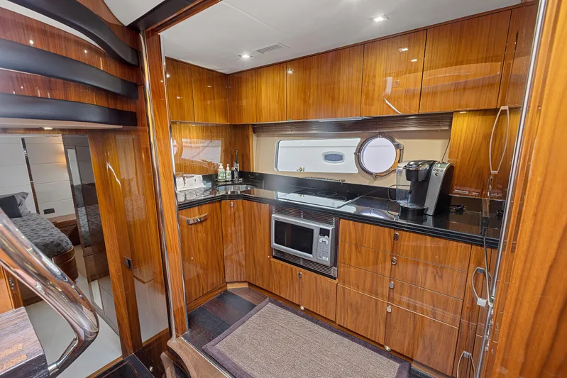 Diggin It Yacht Photos Pics Luxurious kitchen interior of 2015 Sunseeker Predator 68 yacht with modern appliances.