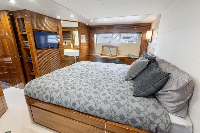 Diggin It Yacht Photos Pics Luxurious bedroom interior of 2015 Sunseeker Predator 68 yacht with modern amenities.