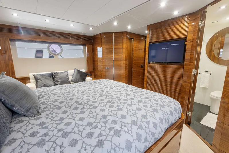 Diggin It Yacht Photos Pics Luxurious bedroom in 2015 Sunseeker Predator 68 yacht with TV and ensuite bathroom.