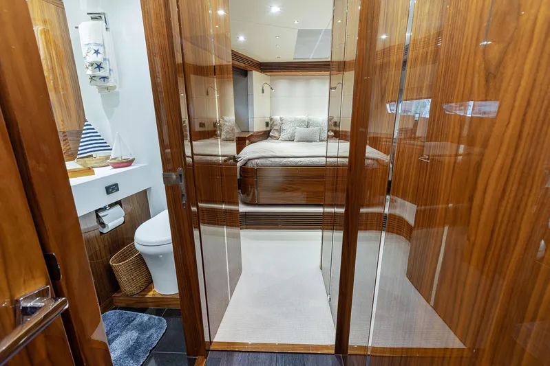 Diggin It Yacht Photos Pics Luxurious interior of 2015 Sunseeker Predator 68 yacht with bedroom and bathroom.