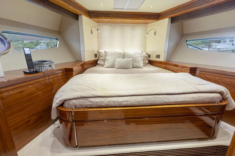Diggin It Yacht Photos Pics Luxurious bedroom interior of 2015 Sunseeker Predator 68 yacht with plush bedding.