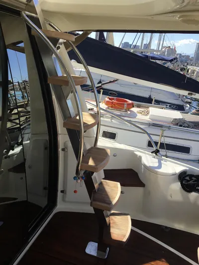 Solesta Yacht Photos Pics Spiral staircase on 2010 Cranchi Atlantique 43 yacht, docked at marina.