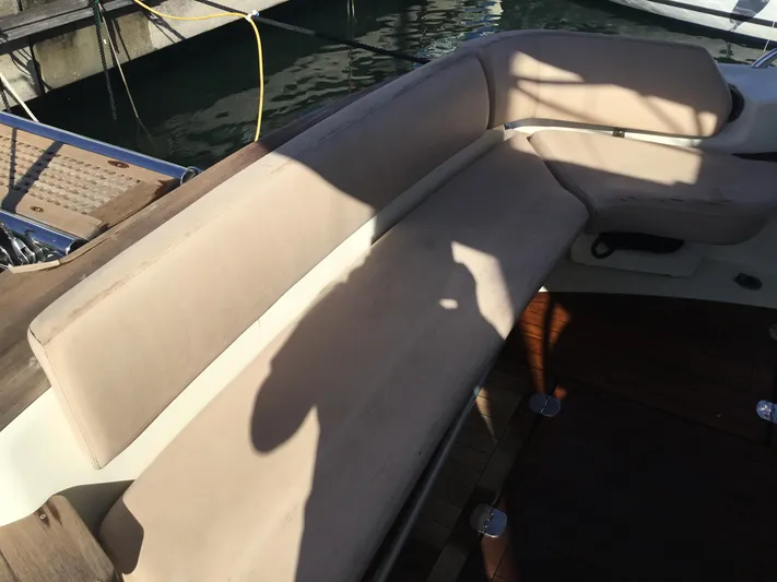 Solesta Yacht Photos Pics Beige seating area on 2010 Cranchi Atlantique 43 yacht, docked at marina.