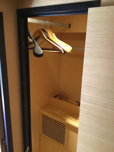 Solesta Yacht Photos Pics Wooden closet interior with hangers in a 2010 Cranchi Atlantique 43 yacht.