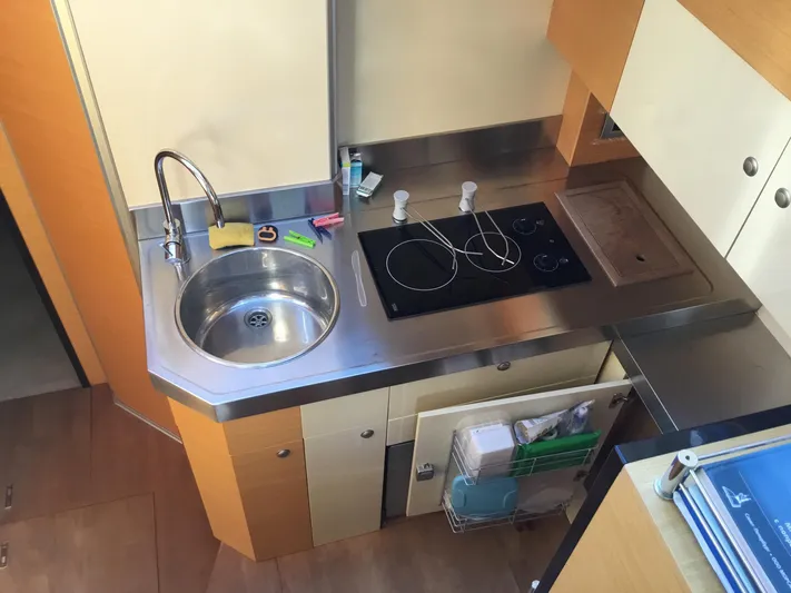 Solesta Yacht Photos Pics Modern kitchen in 2010 Cranchi Atlantique 43 yacht with sink and stovetop.