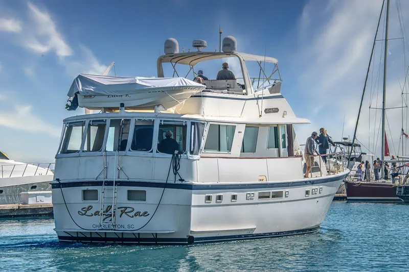Lady Rae Yacht Photos Pics 1987 Hatteras 58 Motor Yacht in marina, Charleston, SC, under clear blue sky.