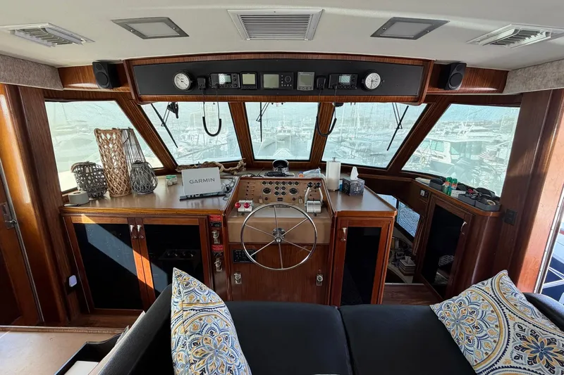 Lady Rae Yacht Photos Pics Interior of a 1987 Hatteras 58 Motor Yacht with helm and navigation equipment.