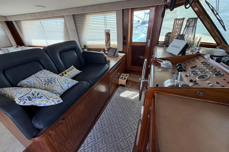 Lady Rae Yacht Photos Pics 1987 Hatteras 58 Motor Yacht interior with helm, seating, and navigation equipment.