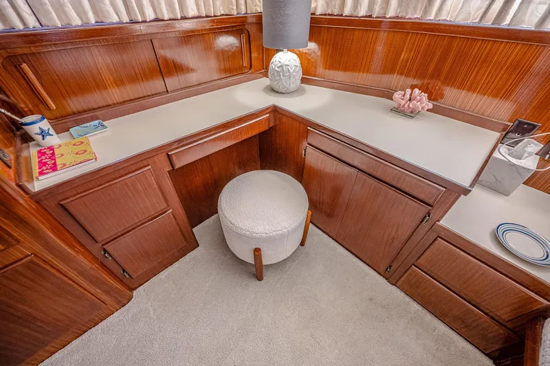 Lady Rae Yacht Photos Pics Elegant 1987 Hatteras 58 Motor Yacht interior with wooden cabinetry and cozy seating area.
