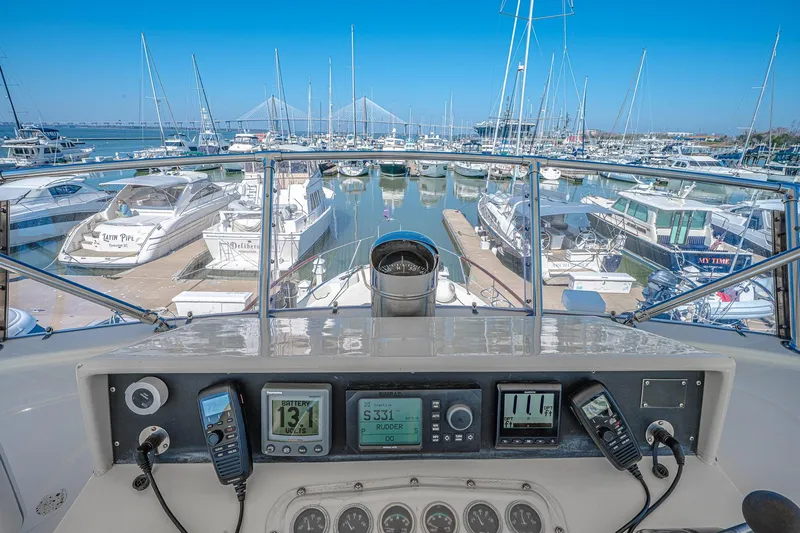 Lady Rae Yacht Photos Pics Helm view from 1987 Hatteras 58 Motor Yacht in a busy marina.