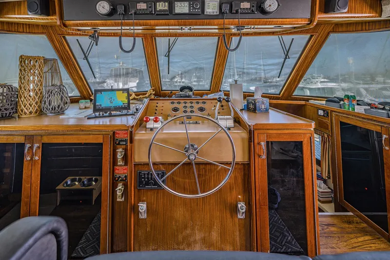 Lady Rae Yacht Photos Pics 1987 Hatteras 58 Motor Yacht helm with wooden dashboard and navigation equipment.