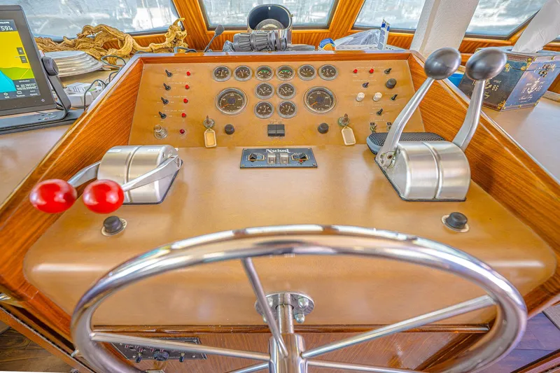 Lady Rae Yacht Photos Pics 1987 Hatteras 58 Motor Yacht helm with steering wheel and control panel.