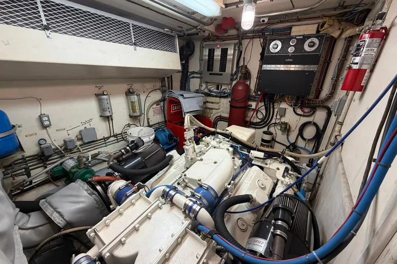 Lady Rae Yacht Photos Pics Engine room of a 1987 Hatteras 58 Motor Yacht with complex machinery and wiring.