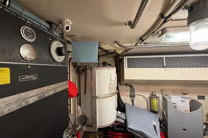 Lady Rae Yacht Photos Pics Engine room of 1987 Hatteras 58 Motor Yacht with control panels and equipment.