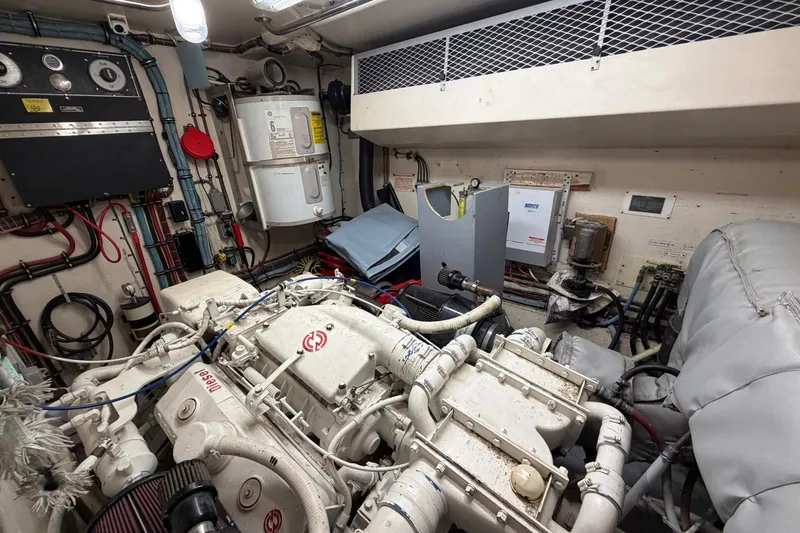 Lady Rae Yacht Photos Pics Engine room of a 1987 Hatteras 58 Motor Yacht, showcasing machinery and equipment.