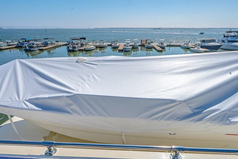 Lady Rae Yacht Photos Pics 1987 Hatteras 58 Motor Yacht with covered deck, docked at marina.