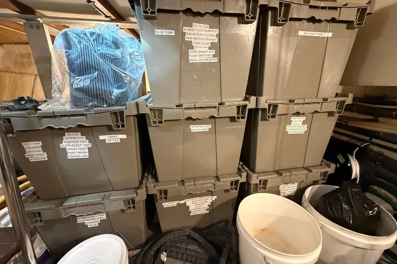 Lady Rae Yacht Photos Pics Storage area with labeled bins and buckets on a 1987 Hatteras 58 Motor Yacht.